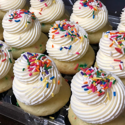 Sprinkle Party cupcakes from Washington, DC bakery Tissy Sweets. This cupcake is a vanilla cake loaded with sprinkles in the batter, topped with rich vanilla buttercream and cheerful rainbow sprinkles.
