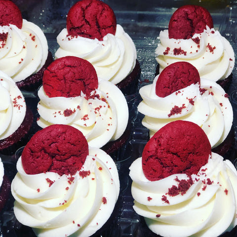 Carrot Cake cupcakes from Tissy Sweets & Bakery in Washington, DC which consist of a red velvet cupcake base and topped with cream cheese buttercream and a red velvet cookie.