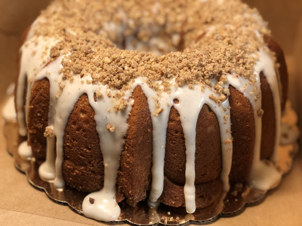 Sweet Potato Pound Cake from Washington, DC based bakery Tissy Sweets Bakery & Cafe. A sweet potato flavored pound cake covered with a cream cheese glaze and luscious pecan crumble.