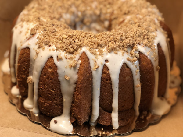 Sweet Potato Pound Cake from Washington, DC based bakery Tissy Sweets Bakery & Cafe. A sweet potato flavored pound cake covered with a cream cheese glaze and luscious pecan crumble.