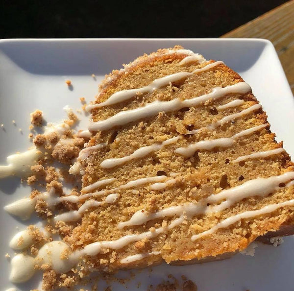 Sweet Potato Pound Cake from Washington, DC based bakery Tissy Sweets Bakery & Cafe. A sweet potato flavored pound cake covered with a cream cheese glaze and luscious pecan crumble.